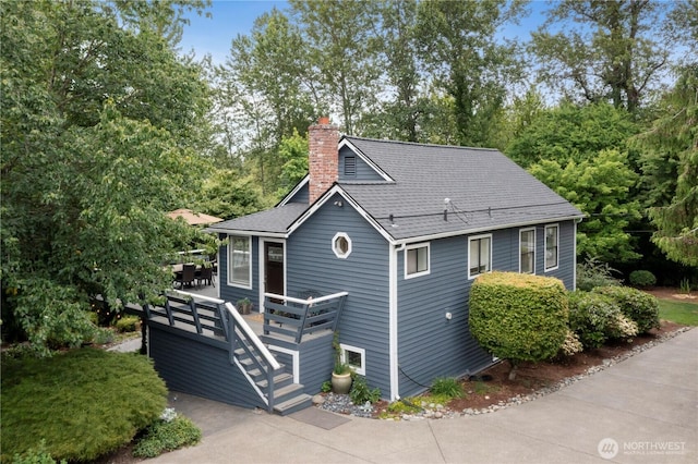 23305 98th Ave S, Kent, WA 98031 - view of front of property featuring a chimney, a deck, and roof with shingles