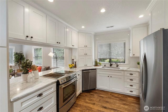 23305 98th Ave S, Kent, WA 98031 - kitchen with stainless steel appliances, white cabinetry, recessed lighting, dark wood-style flooring, and light stone counters