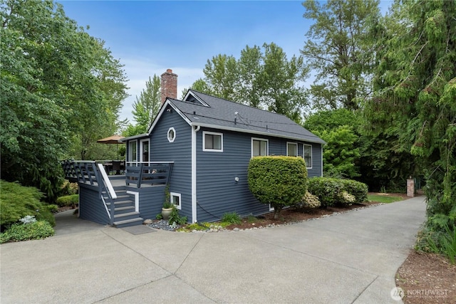 23305 98th Ave S, Kent, WA 98031 - view of property exterior featuring a deck and a chimney
