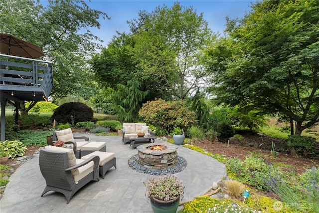 23305 98th Ave S, Kent, WA 98031 - view of patio featuring an outdoor living space with a fire pit and view of wooded area