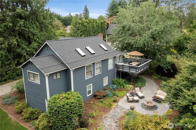 23305 98th Ave S, Kent, WA 98031 - view of property exterior with a wooden deck, a patio, an outdoor living space with a fire pit, a shingled roof, and a chimney