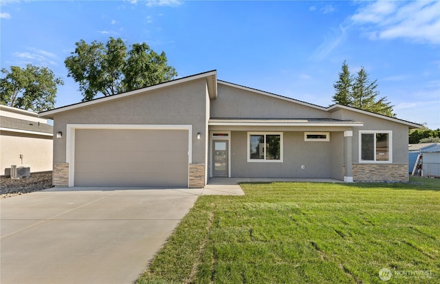 526 S Dorsing St, Moses Lake, WA 98837 - mid-century inspired home with stone siding, an attached garage, concrete driveway, and stucco siding