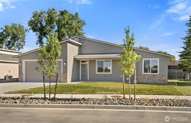 526 S Dorsing St, Moses Lake, WA 98837 - mid-century modern home featuring stone siding, stucco siding, driveway, a garage, and a metal roof