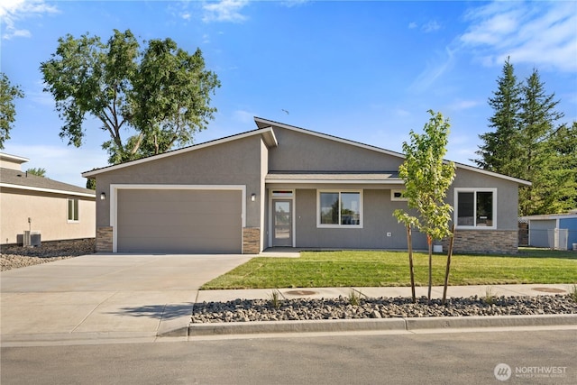 526 S Dorsing St, Moses Lake, WA 98837 - mid-century home featuring stone siding, stucco siding, an attached garage, and driveway