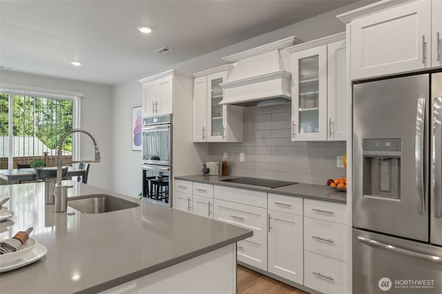 21124 42nd Dr SE, Bothell, WA 98021 - kitchen with stainless steel appliances, white cabinets, backsplash, recessed lighting, and dark countertops
