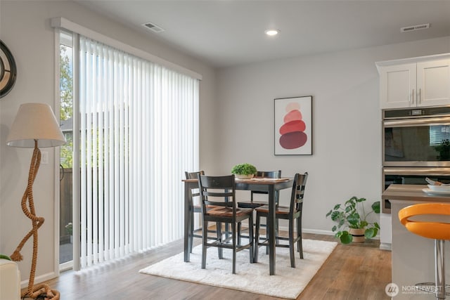 21124 42nd Dr SE, Bothell, WA 98021 - dining area with healthy amount of natural light, wood finished floors, and recessed lighting