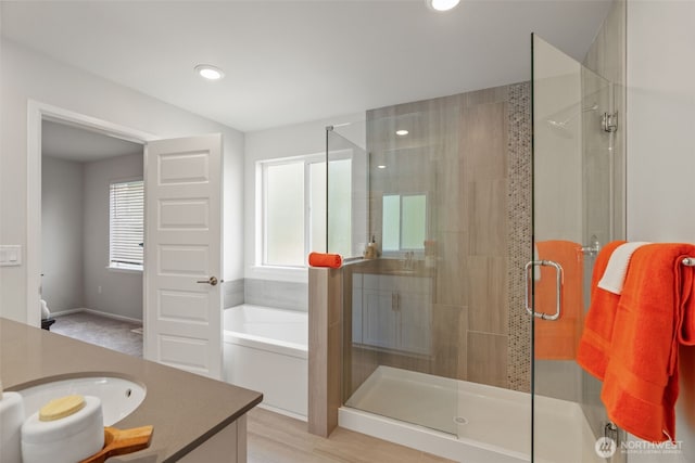 21124 42nd Dr SE, Bothell, WA 98021 - bathroom featuring vanity, a shower stall, a garden tub, and recessed lighting