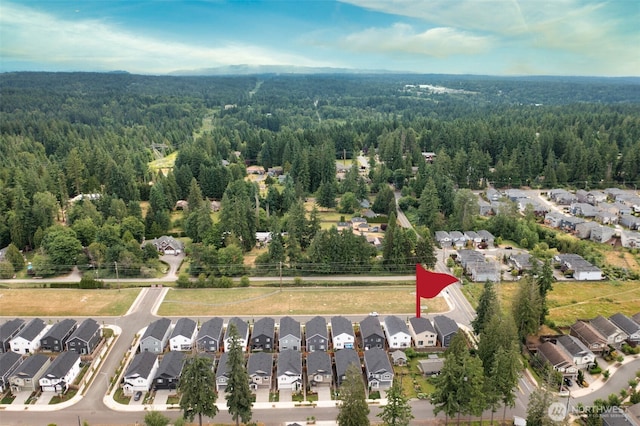 21124 42nd Dr SE, Bothell, WA 98021 - aerial view of property and surrounding area featuring a forest and nearby suburban area