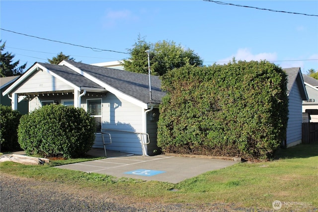 102 N 1st St, Pacific Beach, WA 98571 - view of front of home with a shingled roof and a front lawn