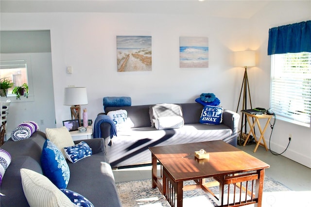 102 N 1st St, Pacific Beach, WA 98571 - living area with concrete floors and baseboards