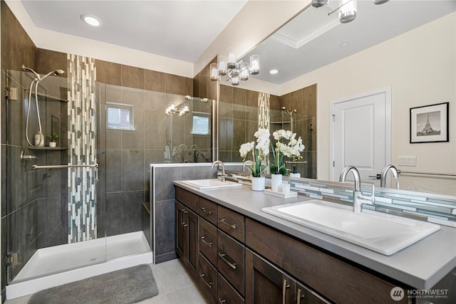 935 7th Ave NE Unit 17.3, Issaquah, WA 98029 - bathroom featuring double vanity, a shower stall, a chandelier, tile patterned floors, and recessed lighting