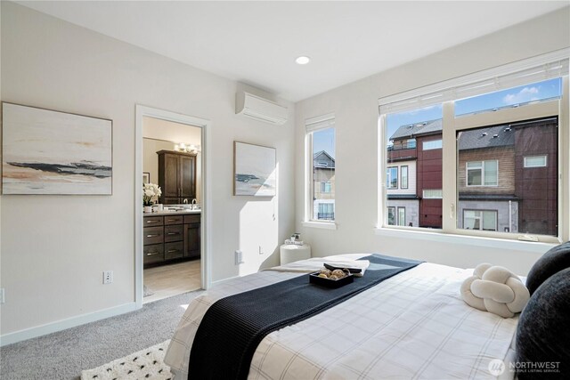 935 7th Ave NE Unit 17.3, Issaquah, WA 98029 - bedroom featuring a wall unit AC, light carpet, and ensuite bath