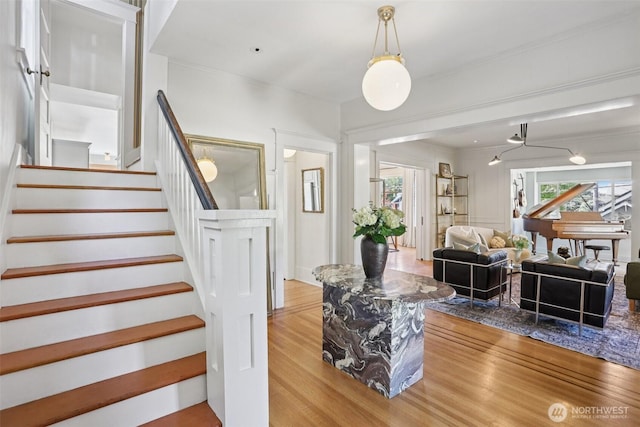 2233 2nd Ave W, Seattle, WA 98119 - living area with wood finished floors, stairway, and crown molding
