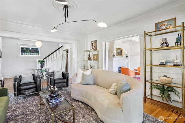 2233 2nd Ave W, Seattle, WA 98119 - living room with ornamental molding, stairway, and wood finished floors