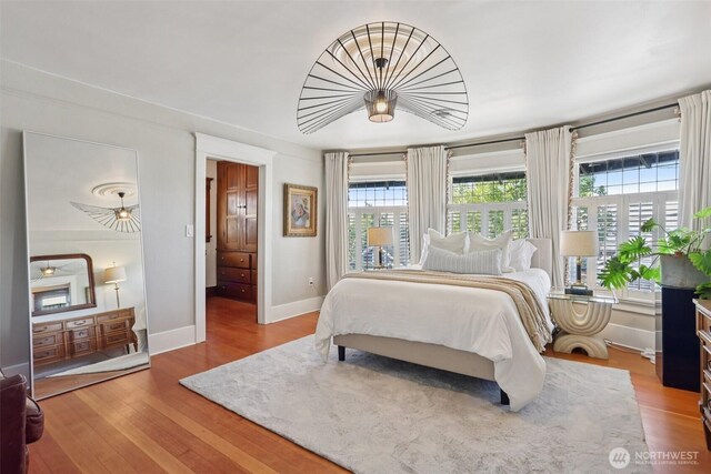 2233 2nd Ave W, Seattle, WA 98119 - bedroom featuring baseboards and wood finished floors