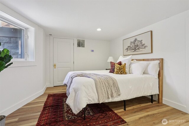2233 2nd Ave W, Seattle, WA 98119 - bedroom with light wood-style floors and recessed lighting