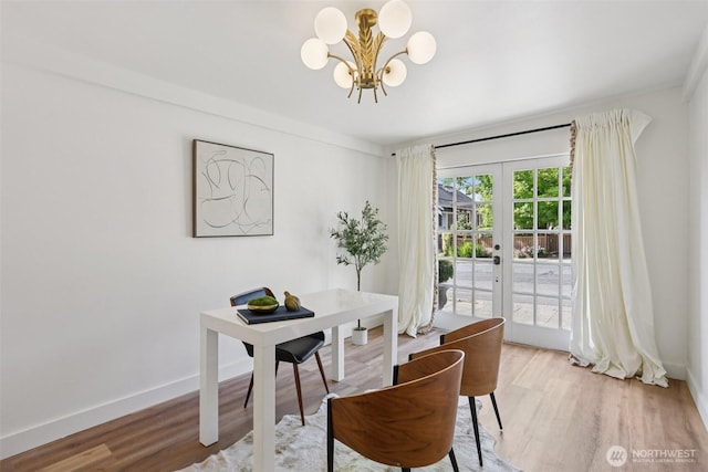 2233 2nd Ave W, Seattle, WA 98119 - office featuring french doors, a chandelier, and light wood-style floors