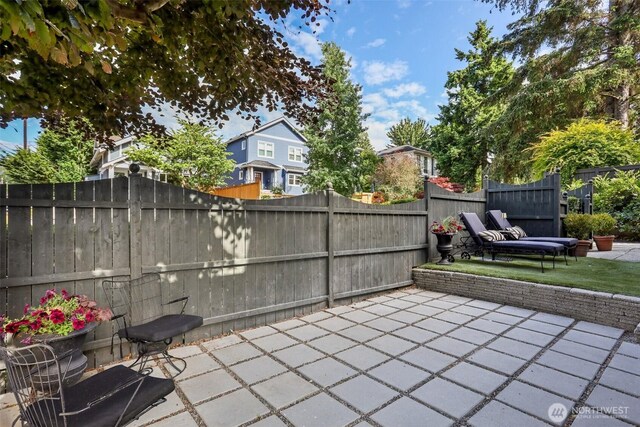 2233 2nd Ave W, Seattle, WA 98119 - fenced backyard featuring a patio