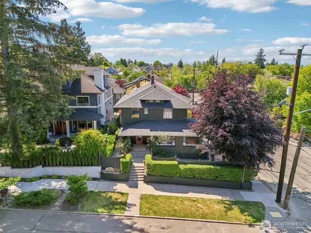 2233 2nd Ave W, Seattle, WA 98119 - view of front of property with a fenced front yard, covered porch, and a residential view