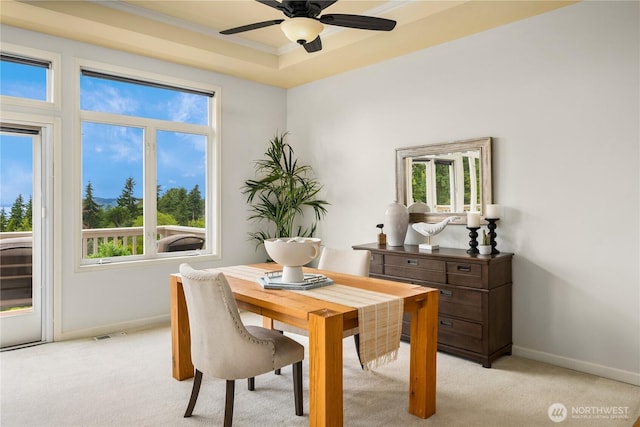 6290 Harbour Heights Parkway Unit A3, Mukilteo, WA 98275 - dining room featuring light carpet, healthy amount of natural light, ceiling fan, crown molding, and a raised ceiling