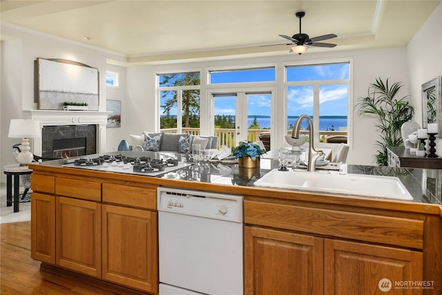 6290 Harbour Heights Parkway Unit A3, Mukilteo, WA 98275 - kitchen with white appliances, ceiling fan, brown cabinets, tile counters, and crown molding