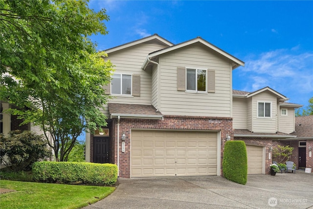 6290 Harbour Heights Parkway Unit A3, Mukilteo, WA 98275 - view of front of house with brick siding, a garage, driveway, and roof with shingles