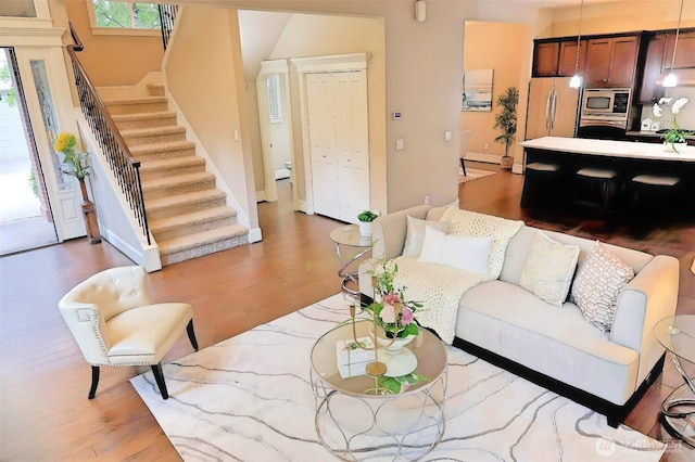 12265 168th Ct NE, Redmond, WA 98052 - living area featuring stairway and wood finished floors