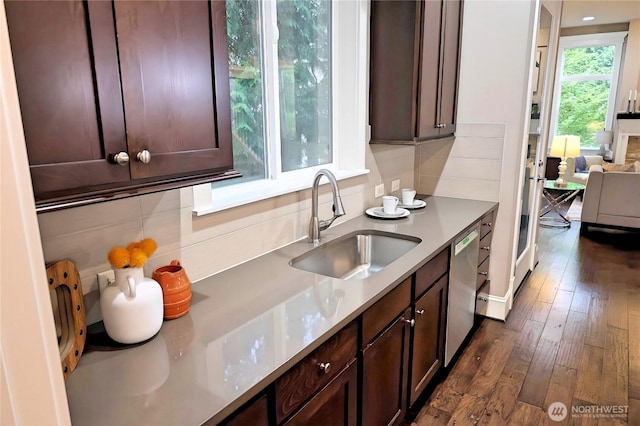 12265 168th Ct NE, Redmond, WA 98052 - kitchen featuring stainless steel dishwasher, dark brown cabinetry, dark wood-style floors, and tasteful backsplash