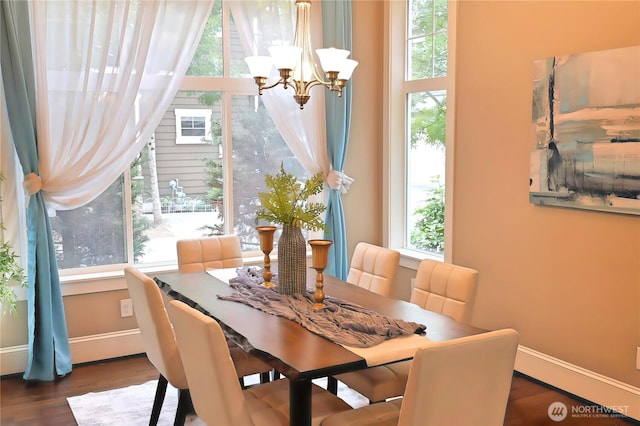 12265 168th Ct NE, Redmond, WA 98052 - dining room with healthy amount of natural light, a chandelier, and dark wood finished floors