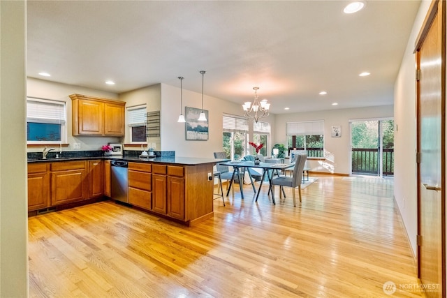 6 Nighthawk Cir, Bellingham, WA 98229 - kitchen featuring stainless steel dishwasher, light wood-type flooring, brown cabinetry, recessed lighting, and dark countertops