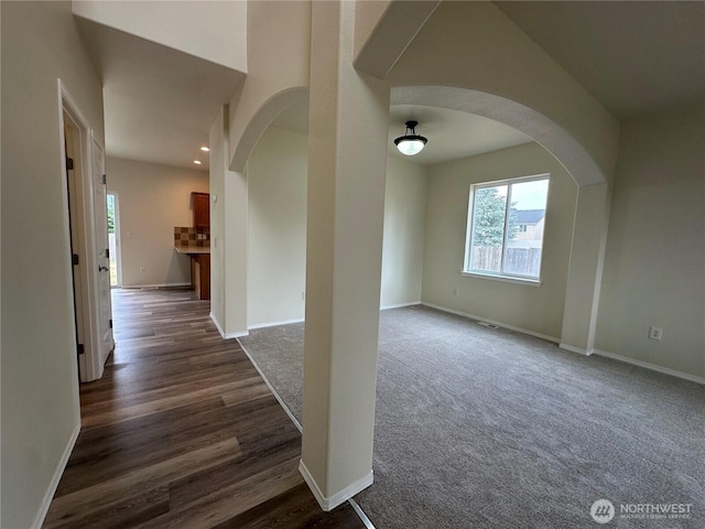 15328 104th Ave SE, Yelm, WA 98597 - hall featuring arched walkways, recessed lighting, and dark wood finished floors