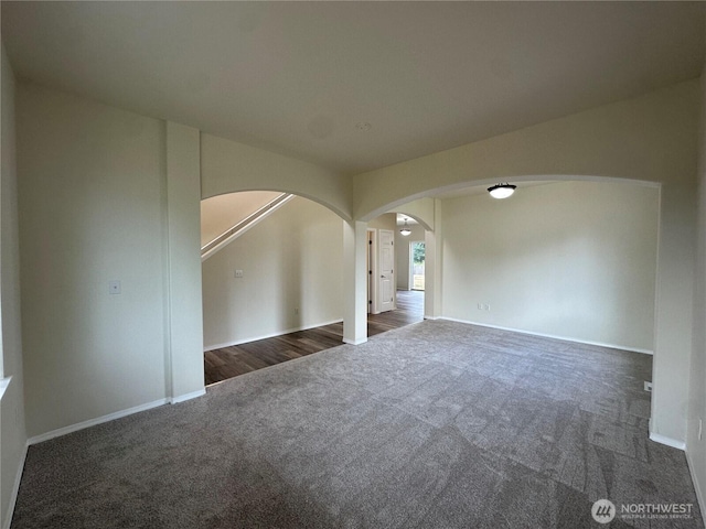 15328 104th Ave SE, Yelm, WA 98597 - unfurnished room featuring arched walkways and dark carpet
