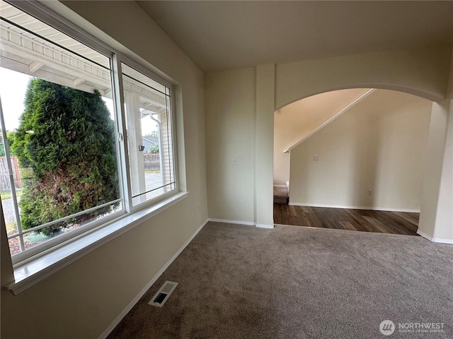 15328 104th Ave SE, Yelm, WA 98597 - carpeted spare room featuring arched walkways and baseboards