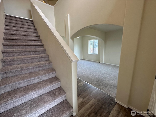 15328 104th Ave SE, Yelm, WA 98597 - stairs with arched walkways, wood finished floors, and carpet flooring