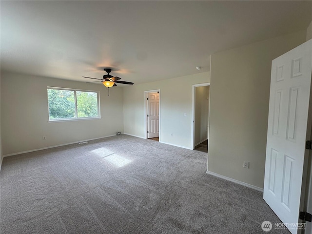 15328 104th Ave SE, Yelm, WA 98597 - carpeted spare room featuring baseboards and ceiling fan