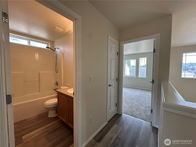 15328 104th Ave SE, Yelm, WA 98597 - bathroom featuring wood finished floors, vanity, healthy amount of natural light, and shower / bath combination
