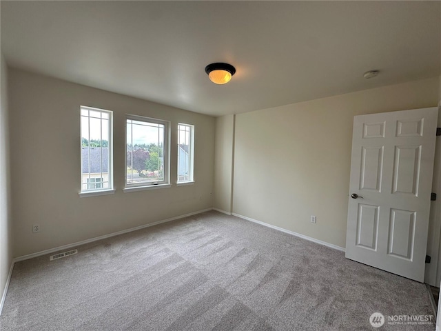 15328 104th Ave SE, Yelm, WA 98597 - carpeted empty room featuring baseboards and a smoke detector