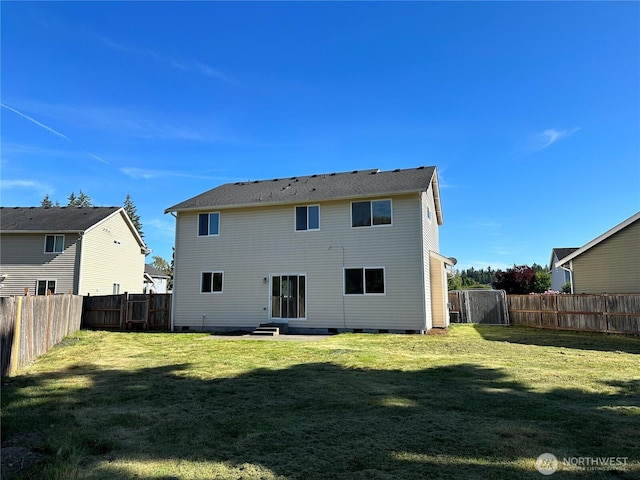 15328 104th Ave SE, Yelm, WA 98597 - back of house featuring a fenced backyard, crawl space, and entry steps