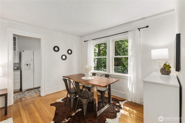 4725 15th Ave NE Unit 22, Seattle, WA 98105 - dining room with ornamental molding and light wood-type flooring