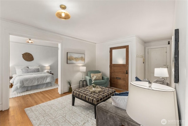 4725 15th Ave NE Unit 22, Seattle, WA 98105 - bedroom featuring light wood-style flooring and crown molding
