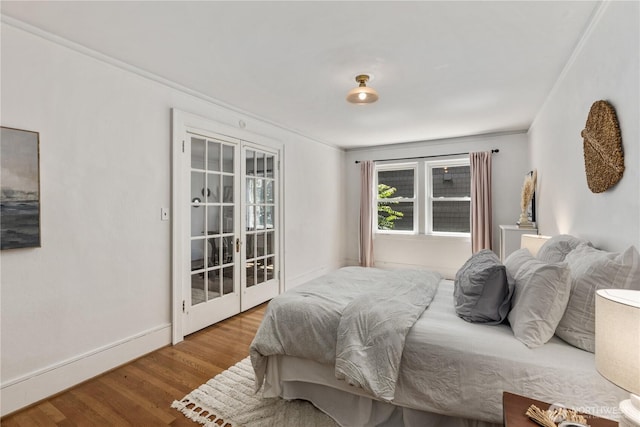 4725 15th Ave NE Unit 22, Seattle, WA 98105 - bedroom featuring wood finished floors, ornamental molding, and access to outside