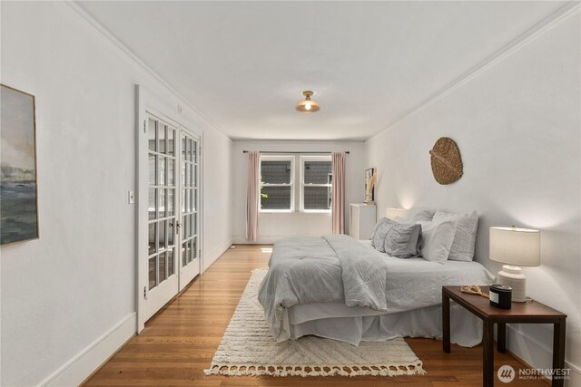 4725 15th Ave NE Unit 22, Seattle, WA 98105 - bedroom featuring light wood-type flooring and french doors