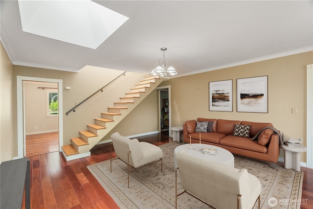2717 Bench Dr, Aberdeen, WA 98520 - living room featuring stairs, wood finished floors, ornamental molding, a chandelier, and a skylight