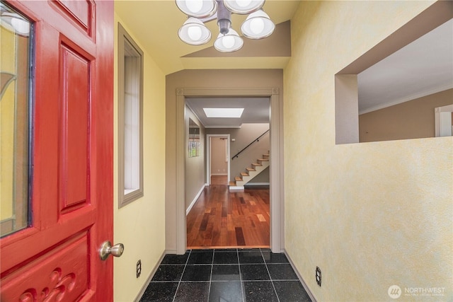 2717 Bench Dr, Aberdeen, WA 98520 - entryway featuring dark tile patterned flooring, a chandelier, and stairway