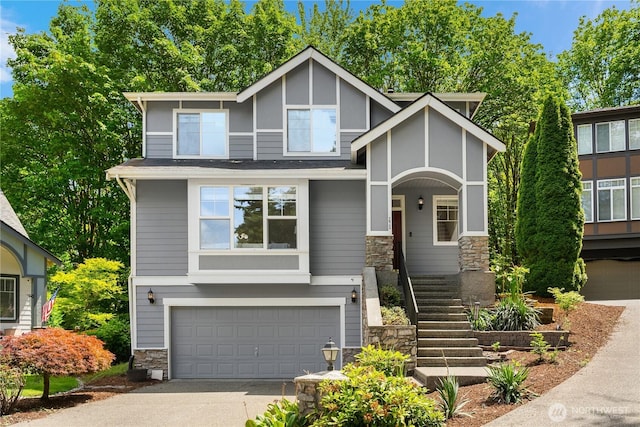 16760 128th Pl NE, Woodinville, WA 98072 - view of front of house with stone siding, an attached garage, stairway, and concrete driveway