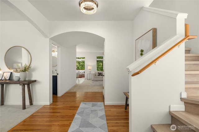 16760 128th Pl NE, Woodinville, WA 98072 - foyer featuring arched walkways, stairway, and wood finished floors