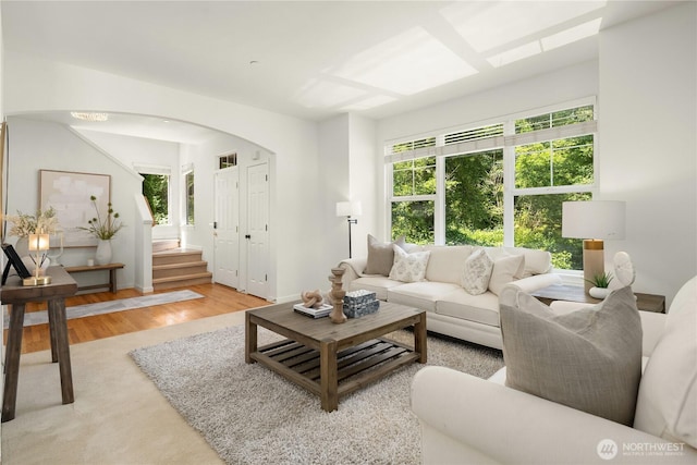 16760 128th Pl NE, Woodinville, WA 98072 - living area featuring light wood finished floors, arched walkways, and stairway