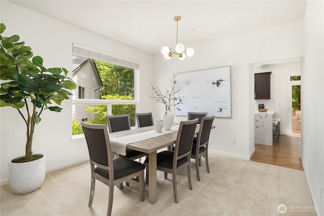 16760 128th Pl NE, Woodinville, WA 98072 - dining room featuring light colored carpet and a chandelier