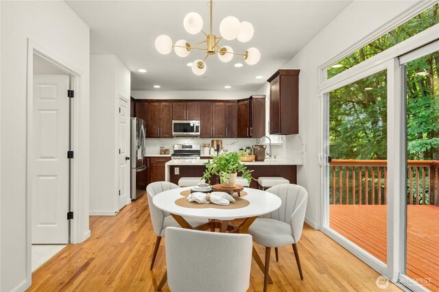 16760 128th Pl NE, Woodinville, WA 98072 - dining space with light wood-style floors, a chandelier, and recessed lighting