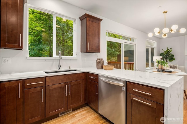 16760 128th Pl NE, Woodinville, WA 98072 - kitchen featuring dishwasher, a peninsula, healthy amount of natural light, and light wood-type flooring